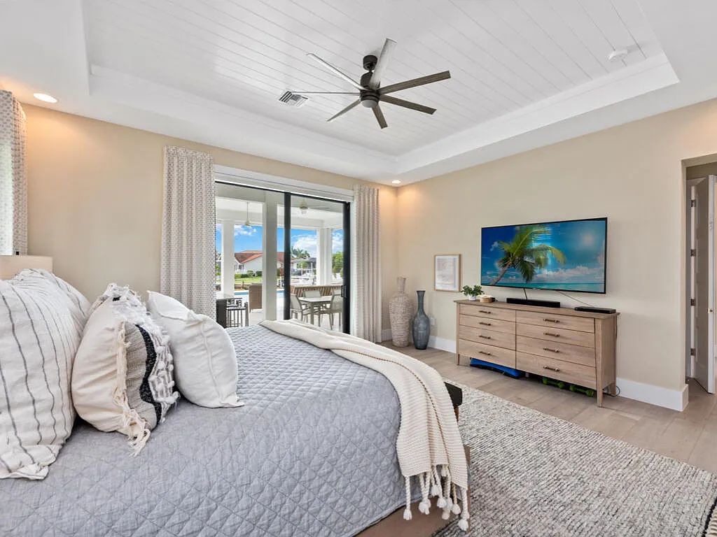 Discover waterfront perfection at 681 Crescent St, Marco Island, FL. This 2020-built, lightly lived-in masterpiece offers 4 bedrooms, 5 baths, and 4,047 square feet of luxury living. Its open split floor plan seamlessly blends indoor and outdoor spaces, revealing breathtaking bay views.