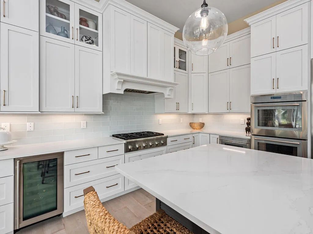 Discover waterfront perfection at 681 Crescent St, Marco Island, FL. This 2020-built, lightly lived-in masterpiece offers 4 bedrooms, 5 baths, and 4,047 square feet of luxury living. Its open split floor plan seamlessly blends indoor and outdoor spaces, revealing breathtaking bay views.