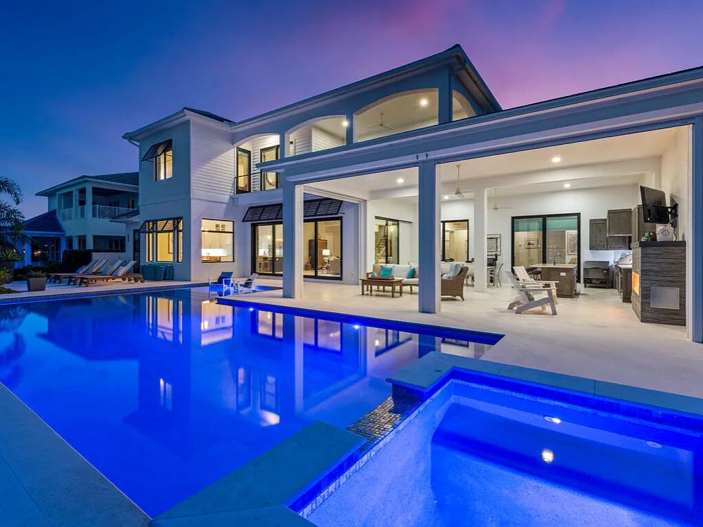 Discover waterfront perfection at 681 Crescent St, Marco Island, FL. This 2020-built, lightly lived-in masterpiece offers 4 bedrooms, 5 baths, and 4,047 square feet of luxury living. Its open split floor plan seamlessly blends indoor and outdoor spaces, revealing breathtaking bay views.