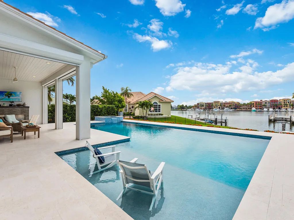 Discover waterfront perfection at 681 Crescent St, Marco Island, FL. This 2020-built, lightly lived-in masterpiece offers 4 bedrooms, 5 baths, and 4,047 square feet of luxury living. Its open split floor plan seamlessly blends indoor and outdoor spaces, revealing breathtaking bay views.