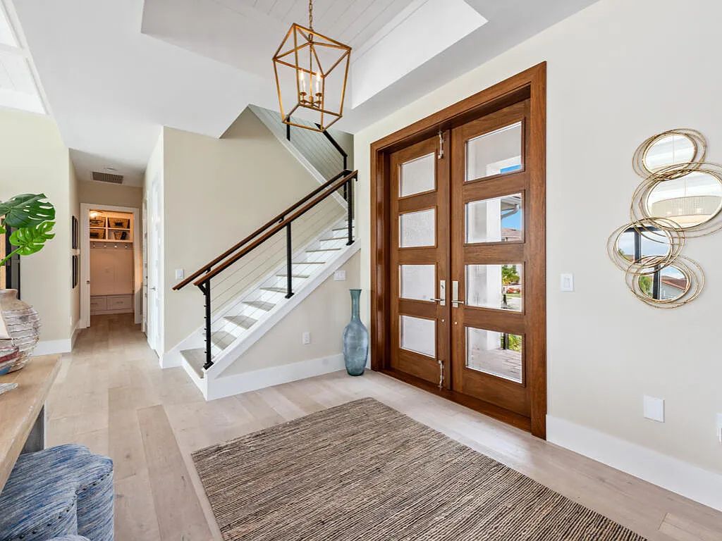 Discover waterfront perfection at 681 Crescent St, Marco Island, FL. This 2020-built, lightly lived-in masterpiece offers 4 bedrooms, 5 baths, and 4,047 square feet of luxury living. Its open split floor plan seamlessly blends indoor and outdoor spaces, revealing breathtaking bay views.