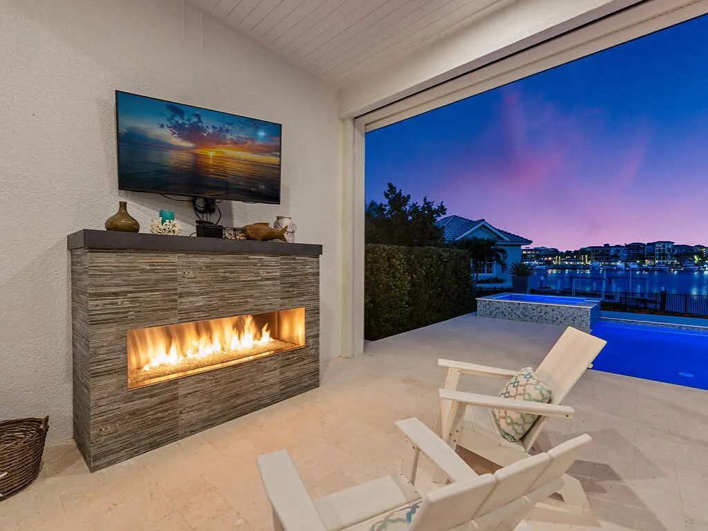 Discover waterfront perfection at 681 Crescent St, Marco Island, FL. This 2020-built, lightly lived-in masterpiece offers 4 bedrooms, 5 baths, and 4,047 square feet of luxury living. Its open split floor plan seamlessly blends indoor and outdoor spaces, revealing breathtaking bay views.