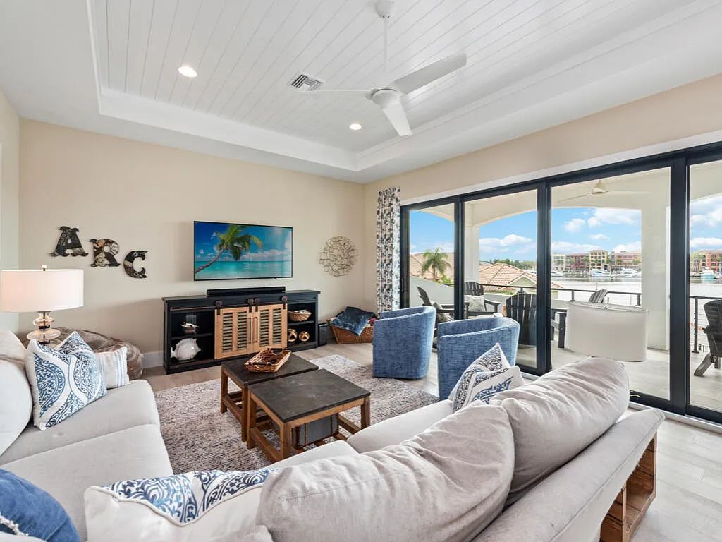 Discover waterfront perfection at 681 Crescent St, Marco Island, FL. This 2020-built, lightly lived-in masterpiece offers 4 bedrooms, 5 baths, and 4,047 square feet of luxury living. Its open split floor plan seamlessly blends indoor and outdoor spaces, revealing breathtaking bay views.