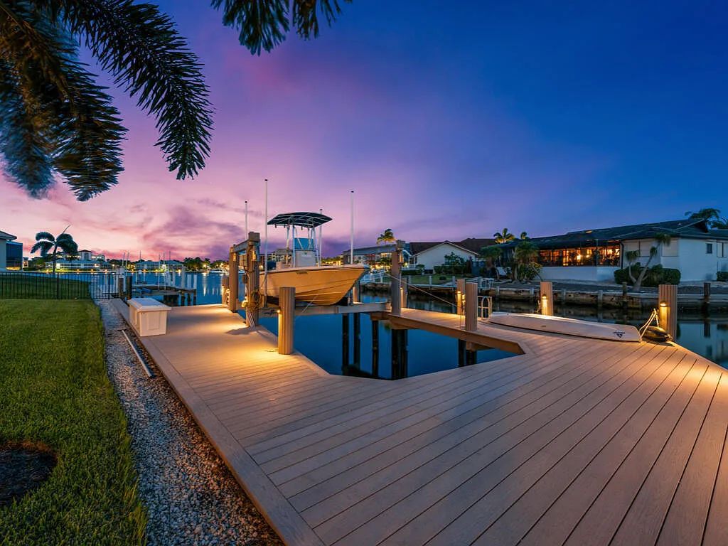 Discover waterfront perfection at 681 Crescent St, Marco Island, FL. This 2020-built, lightly lived-in masterpiece offers 4 bedrooms, 5 baths, and 4,047 square feet of luxury living. Its open split floor plan seamlessly blends indoor and outdoor spaces, revealing breathtaking bay views.