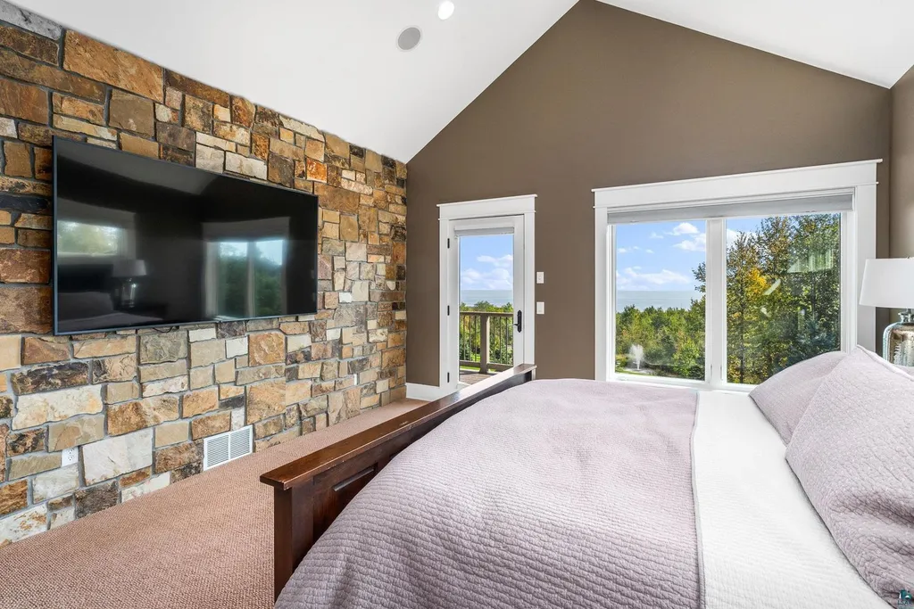 . 123 Montauk Lane Home in Duluth, MinnesotaDiscover your dream home on 3 acres in Duluth with this unique 5+ bedroom, 5 bath custom oasis. Meticulously crafted with imported materials and top-of-the-line features, including lake views from almost every room, a gourmet kitchen, a megardeck addition, and more.