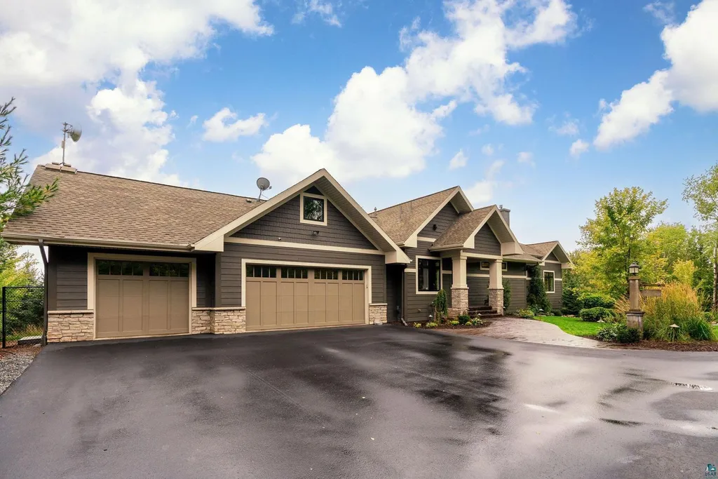 . 123 Montauk Lane Home in Duluth, MinnesotaDiscover your dream home on 3 acres in Duluth with this unique 5+ bedroom, 5 bath custom oasis. Meticulously crafted with imported materials and top-of-the-line features, including lake views from almost every room, a gourmet kitchen, a megardeck addition, and more.