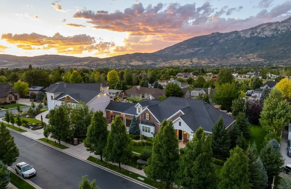 1263 East Chapman Court Home in Alpine, Utah. Step into the lap of luxury in this expansive 13,000 sq ft home in Alpine, Utah. With 8 oversized bedrooms, 6 bathrooms, a 13-car garage, and an outdoor entertainment paradise featuring a pool, spa, and lush landscaping, this property is perfect for hosting and living in grand style.