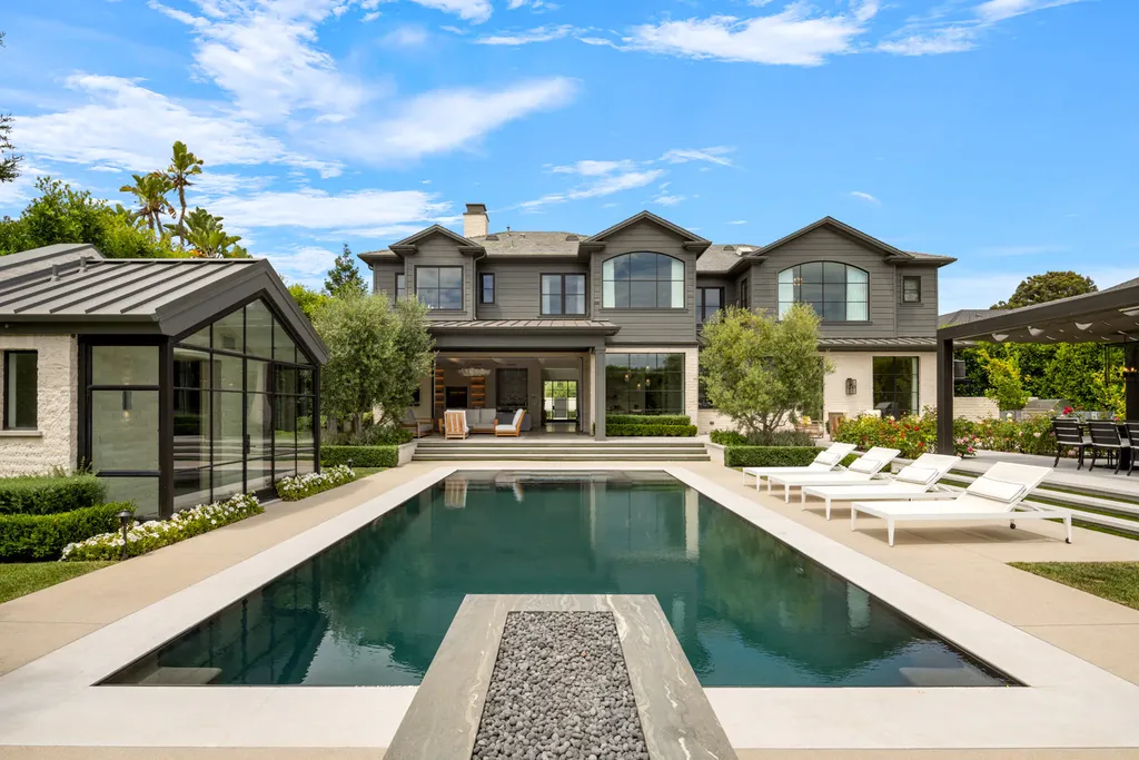 12740 Hanover Street Home in Los Angeles, California. Explore a luxurious and impressive estate in Los Angeles, offering unrivaled panoramic views from downtown to the Pacific Ocean. Floor-to-ceiling automatic glass doors seamlessly blend indoor and outdoor spaces.