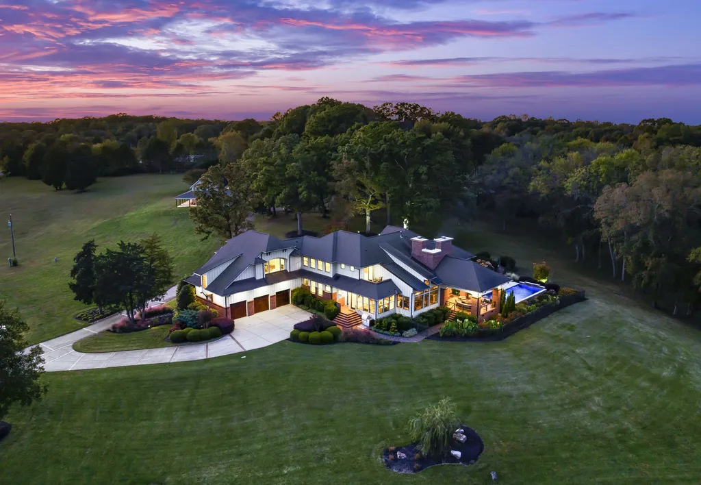 13500 Cabarrus Station Road Home in Midland, North Carolina. Experience the epitome of country living at Clover Lake, an architecturally designed estate on over 30 acres of rolling pastures, serene ponds, and private outdoor spaces just 35 minutes from Uptown Charlotte. This exceptional property features a 3-car garage, gated entry, gourmet kitchen, spacious bedrooms with en-suite baths, and a 4-stall horse barn with a shop, tack room, and office.