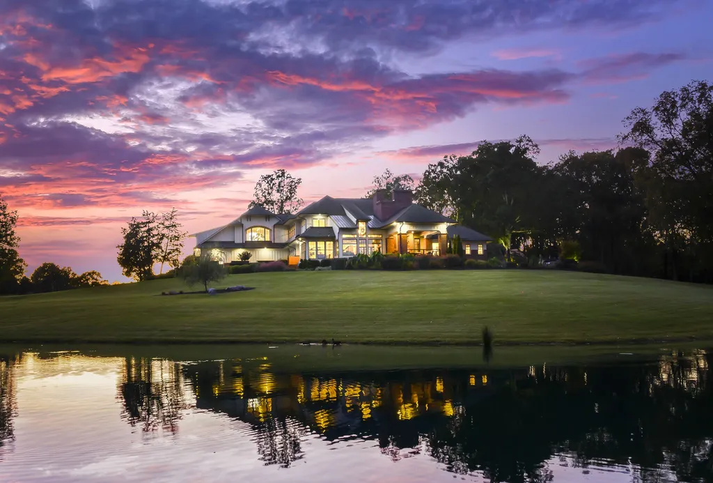13500 Cabarrus Station Road Home in Midland, North Carolina. Experience the epitome of country living at Clover Lake, an architecturally designed estate on over 30 acres of rolling pastures, serene ponds, and private outdoor spaces just 35 minutes from Uptown Charlotte. This exceptional property features a 3-car garage, gated entry, gourmet kitchen, spacious bedrooms with en-suite baths, and a 4-stall horse barn with a shop, tack room, and office.