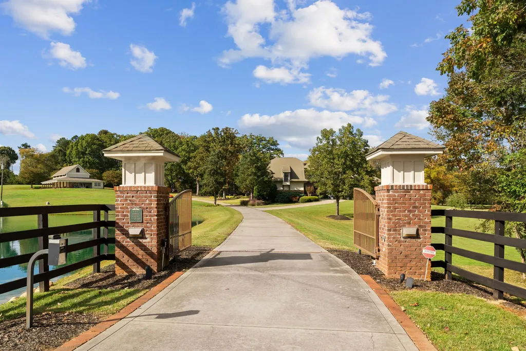 13500 Cabarrus Station Road Home in Midland, North Carolina. Experience the epitome of country living at Clover Lake, an architecturally designed estate on over 30 acres of rolling pastures, serene ponds, and private outdoor spaces just 35 minutes from Uptown Charlotte. This exceptional property features a 3-car garage, gated entry, gourmet kitchen, spacious bedrooms with en-suite baths, and a 4-stall horse barn with a shop, tack room, and office.