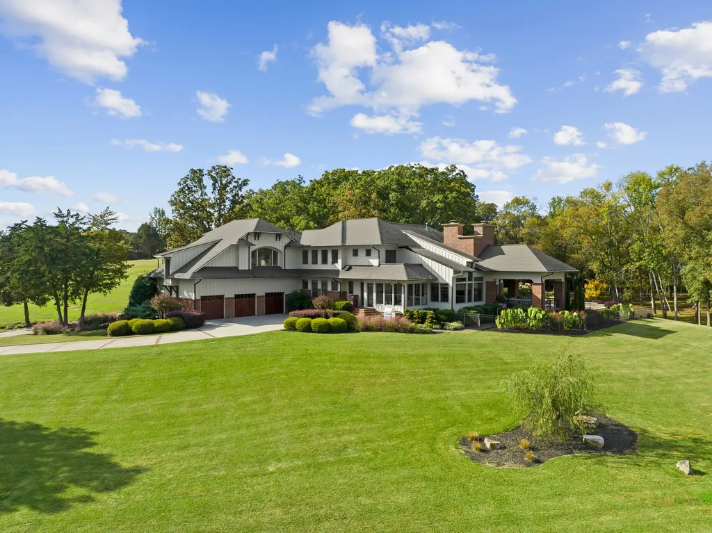 13500 Cabarrus Station Road Home in Midland, North Carolina. Experience the epitome of country living at Clover Lake, an architecturally designed estate on over 30 acres of rolling pastures, serene ponds, and private outdoor spaces just 35 minutes from Uptown Charlotte. This exceptional property features a 3-car garage, gated entry, gourmet kitchen, spacious bedrooms with en-suite baths, and a 4-stall horse barn with a shop, tack room, and office.