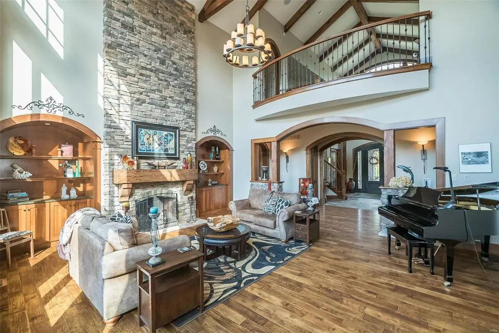 1377 South Mason Road Home in Saint Louis, Missouri. Discover this remarkable 3.3-acre estate bordering Queeny Park, boasting an array of extraordinary outdoor amenities and unmatched privacy. With a massive 2-story foyer, designer kitchen, primary suite with a see-through fireplace, and a sprawling lower level featuring a rec room, theatre, gym, and more. 
