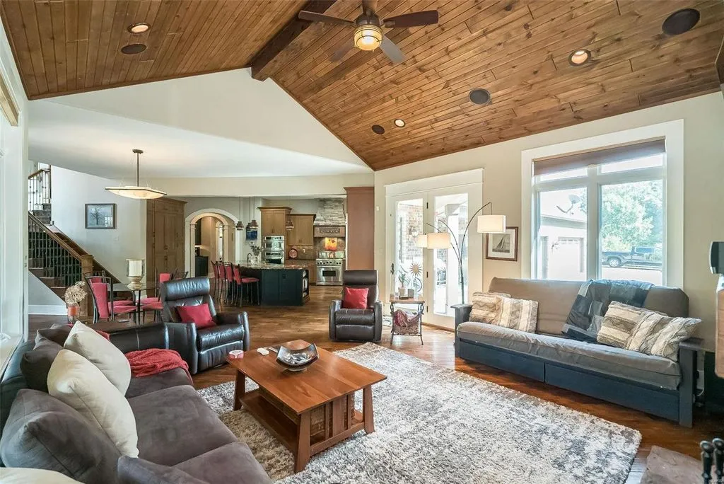 1377 South Mason Road Home in Saint Louis, Missouri. Discover this remarkable 3.3-acre estate bordering Queeny Park, boasting an array of extraordinary outdoor amenities and unmatched privacy. With a massive 2-story foyer, designer kitchen, primary suite with a see-through fireplace, and a sprawling lower level featuring a rec room, theatre, gym, and more. 