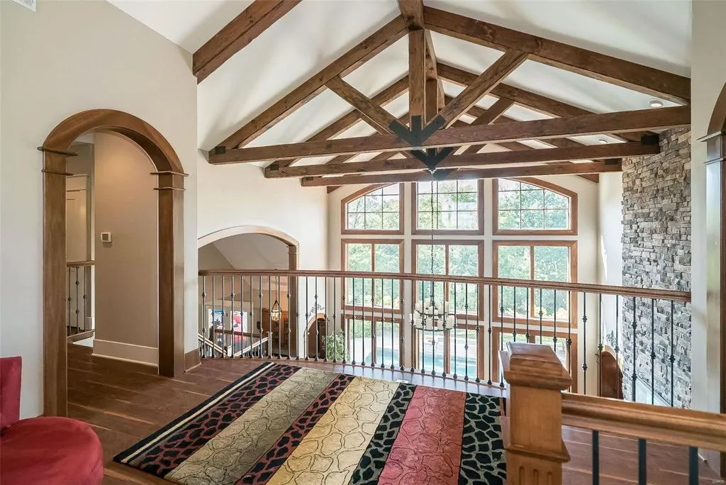 1377 South Mason Road Home in Saint Louis, Missouri. Discover this remarkable 3.3-acre estate bordering Queeny Park, boasting an array of extraordinary outdoor amenities and unmatched privacy. With a massive 2-story foyer, designer kitchen, primary suite with a see-through fireplace, and a sprawling lower level featuring a rec room, theatre, gym, and more. 