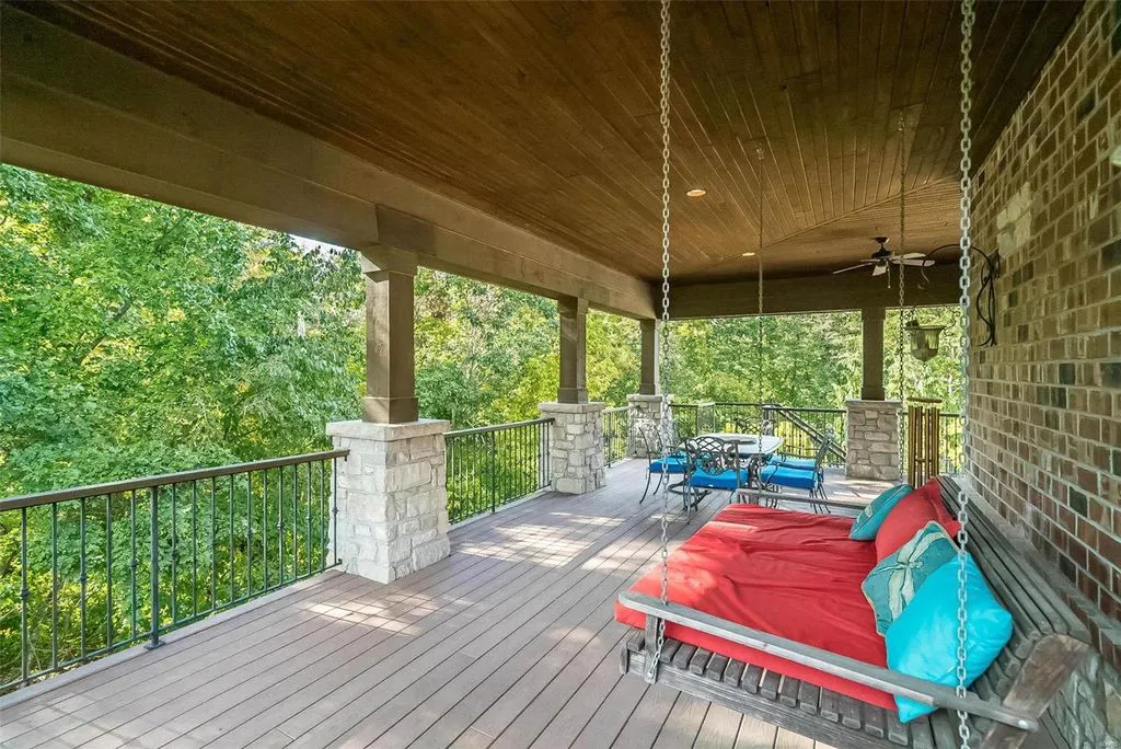 1377 South Mason Road Home in Saint Louis, Missouri. Discover this remarkable 3.3-acre estate bordering Queeny Park, boasting an array of extraordinary outdoor amenities and unmatched privacy. With a massive 2-story foyer, designer kitchen, primary suite with a see-through fireplace, and a sprawling lower level featuring a rec room, theatre, gym, and more. 