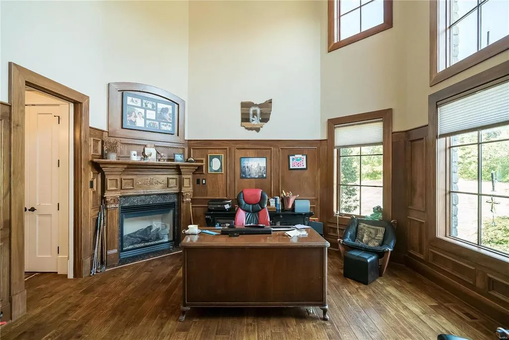 1377 South Mason Road Home in Saint Louis, Missouri. Discover this remarkable 3.3-acre estate bordering Queeny Park, boasting an array of extraordinary outdoor amenities and unmatched privacy. With a massive 2-story foyer, designer kitchen, primary suite with a see-through fireplace, and a sprawling lower level featuring a rec room, theatre, gym, and more. 