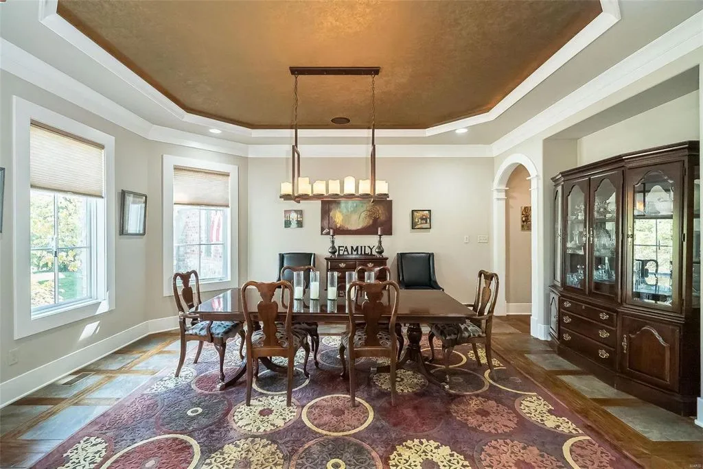 1377 South Mason Road Home in Saint Louis, Missouri. Discover this remarkable 3.3-acre estate bordering Queeny Park, boasting an array of extraordinary outdoor amenities and unmatched privacy. With a massive 2-story foyer, designer kitchen, primary suite with a see-through fireplace, and a sprawling lower level featuring a rec room, theatre, gym, and more. 