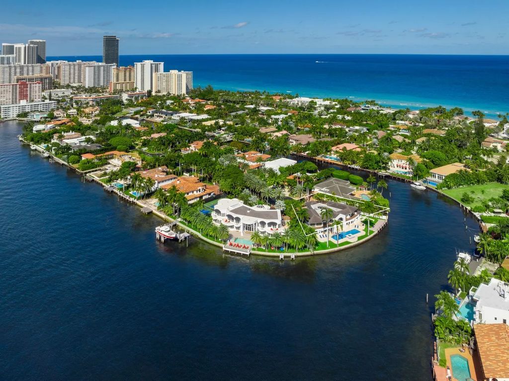 Experience unparalleled luxury in this 7-bedroom, 7-bathroom Golden Beach estate, situated on a 0.41-acre lot with 190 feet of prime waterfront. Renovated to perfection, this contemporary retreat boasts double-height ceilings, a chef's kitchen, a grand master suite, an oversized pool, summer kitchen, and a fully equipped 50-foot dock.
