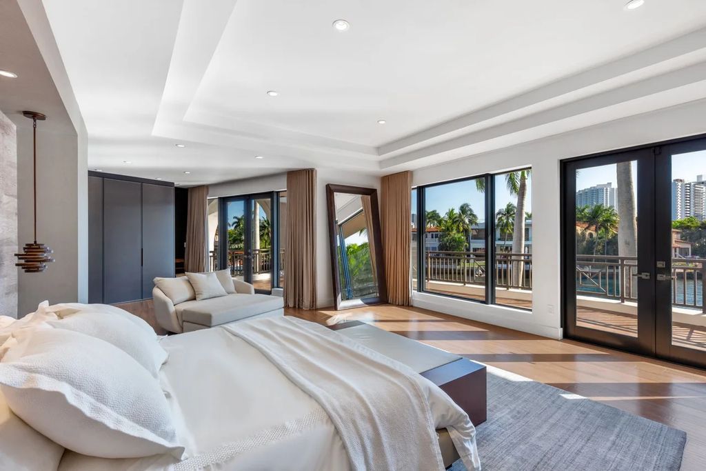 Experience unparalleled luxury in this 7-bedroom, 7-bathroom Golden Beach estate, situated on a 0.41-acre lot with 190 feet of prime waterfront. Renovated to perfection, this contemporary retreat boasts double-height ceilings, a chef's kitchen, a grand master suite, an oversized pool, summer kitchen, and a fully equipped 50-foot dock.