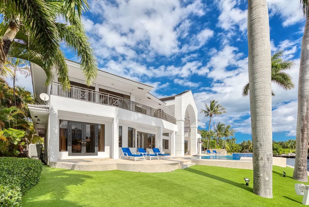 Experience unparalleled luxury in this 7-bedroom, 7-bathroom Golden Beach estate, situated on a 0.41-acre lot with 190 feet of prime waterfront. Renovated to perfection, this contemporary retreat boasts double-height ceilings, a chef's kitchen, a grand master suite, an oversized pool, summer kitchen, and a fully equipped 50-foot dock.