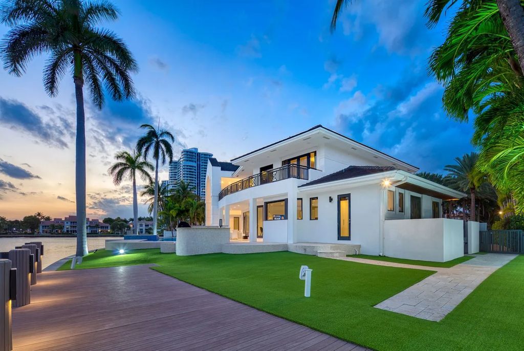 Experience unparalleled luxury in this 7-bedroom, 7-bathroom Golden Beach estate, situated on a 0.41-acre lot with 190 feet of prime waterfront. Renovated to perfection, this contemporary retreat boasts double-height ceilings, a chef's kitchen, a grand master suite, an oversized pool, summer kitchen, and a fully equipped 50-foot dock.