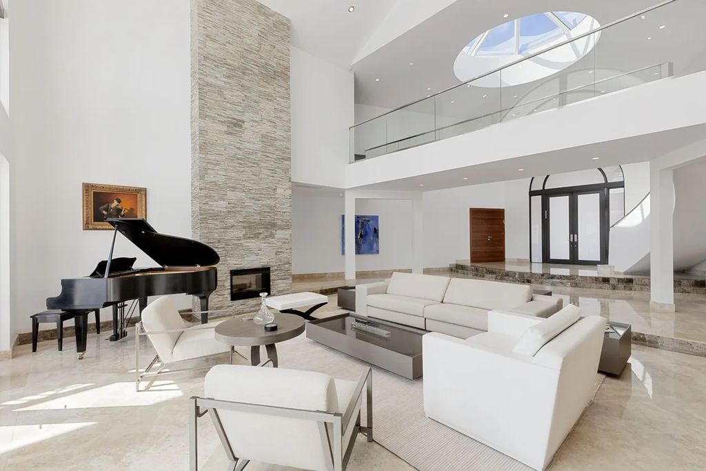 Experience unparalleled luxury in this 7-bedroom, 7-bathroom Golden Beach estate, situated on a 0.41-acre lot with 190 feet of prime waterfront. Renovated to perfection, this contemporary retreat boasts double-height ceilings, a chef's kitchen, a grand master suite, an oversized pool, summer kitchen, and a fully equipped 50-foot dock.