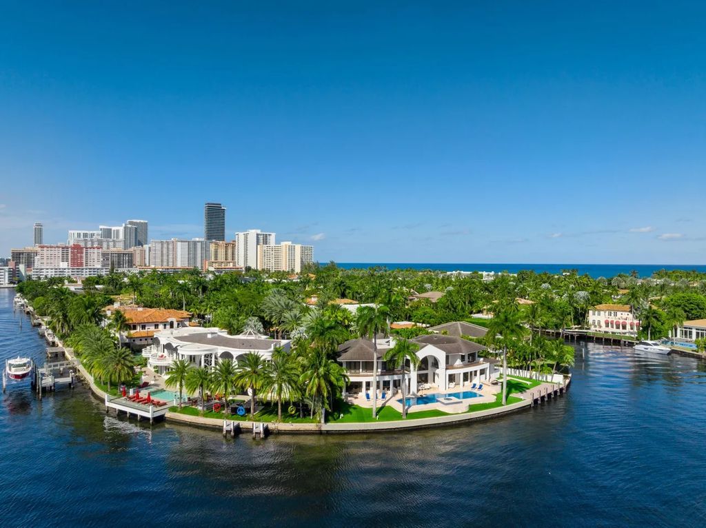 Experience unparalleled luxury in this 7-bedroom, 7-bathroom Golden Beach estate, situated on a 0.41-acre lot with 190 feet of prime waterfront. Renovated to perfection, this contemporary retreat boasts double-height ceilings, a chef's kitchen, a grand master suite, an oversized pool, summer kitchen, and a fully equipped 50-foot dock.