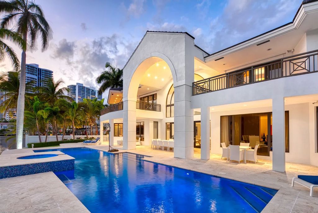 Experience unparalleled luxury in this 7-bedroom, 7-bathroom Golden Beach estate, situated on a 0.41-acre lot with 190 feet of prime waterfront. Renovated to perfection, this contemporary retreat boasts double-height ceilings, a chef's kitchen, a grand master suite, an oversized pool, summer kitchen, and a fully equipped 50-foot dock.