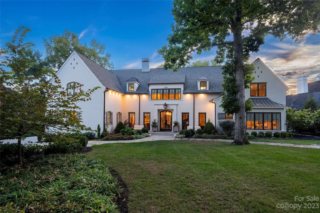 2215 Cortelyou Road Home in Charlotte, North Carolina. Discover the epitome of luxury living in this South Park masterpiece featuring 6 spacious bedrooms, 5 full and 2 half bathrooms, and exquisite craftsmanship throughout. Chef's dream kitchen, a stunning primary suite, media room, sauna, and resort-style outdoor amenities, including a custom pool and outdoor kitchen.