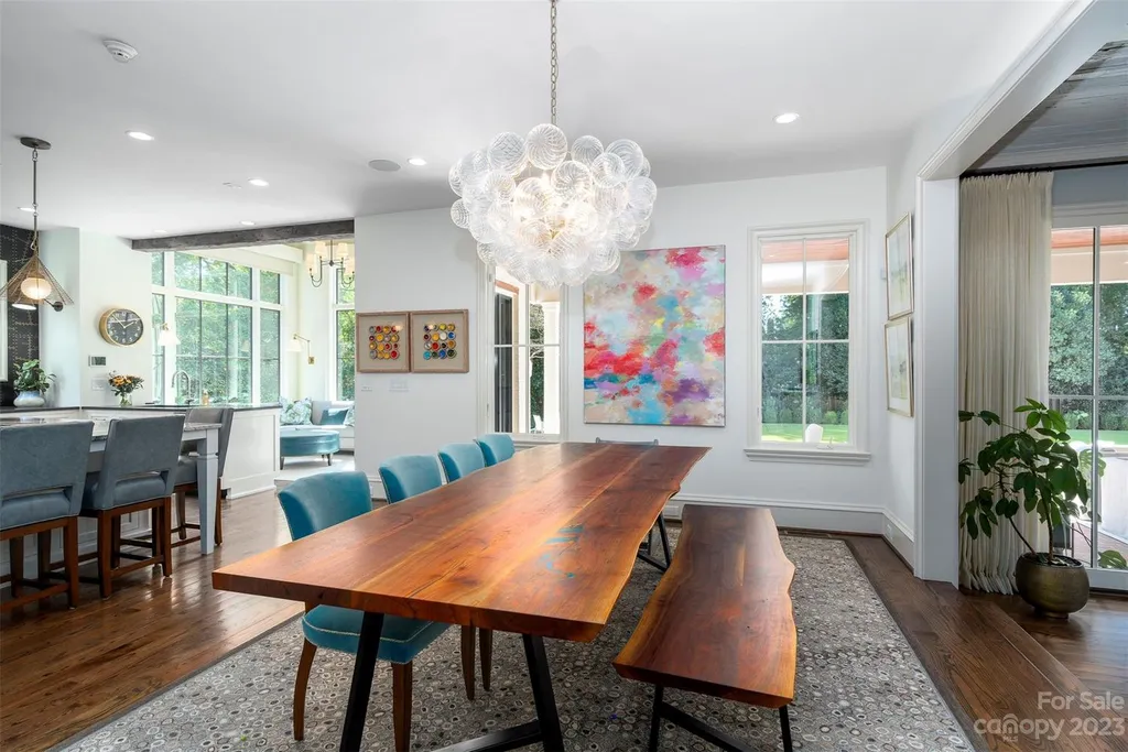 2215 Cortelyou Road Home in Charlotte, North Carolina. Discover the epitome of luxury living in this South Park masterpiece featuring 6 spacious bedrooms, 5 full and 2 half bathrooms, and exquisite craftsmanship throughout. Chef's dream kitchen, a stunning primary suite, media room, sauna, and resort-style outdoor amenities, including a custom pool and outdoor kitchen.