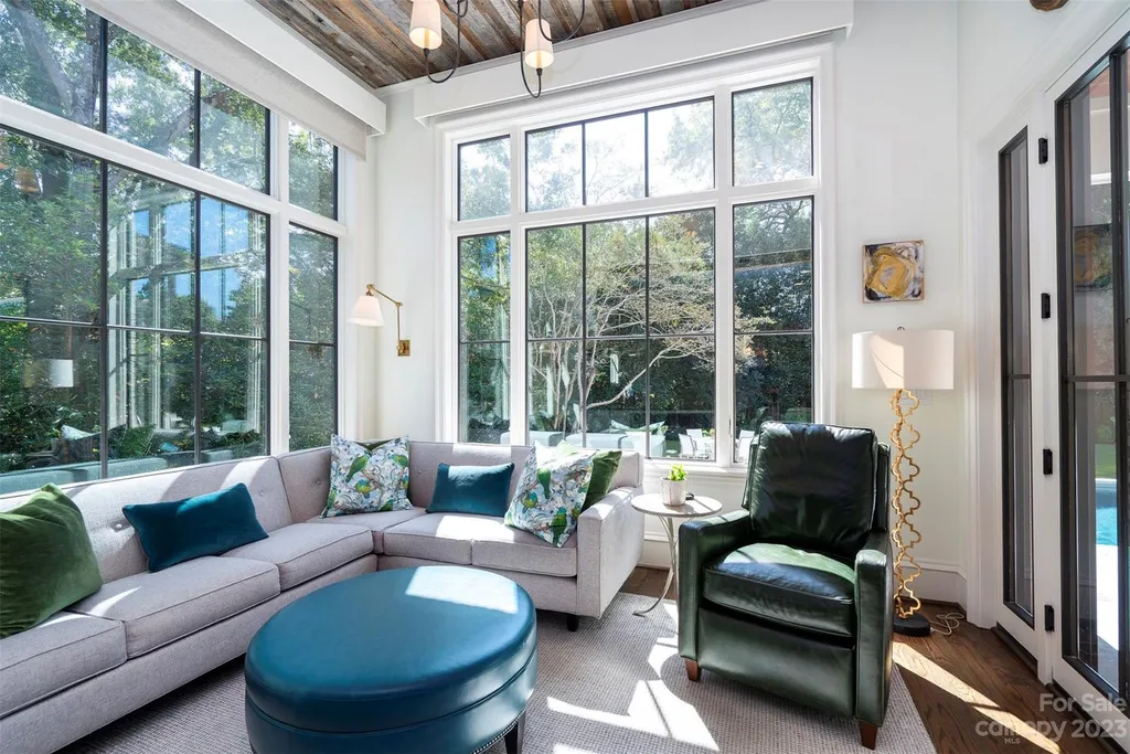 2215 Cortelyou Road Home in Charlotte, North Carolina. Discover the epitome of luxury living in this South Park masterpiece featuring 6 spacious bedrooms, 5 full and 2 half bathrooms, and exquisite craftsmanship throughout. Chef's dream kitchen, a stunning primary suite, media room, sauna, and resort-style outdoor amenities, including a custom pool and outdoor kitchen.