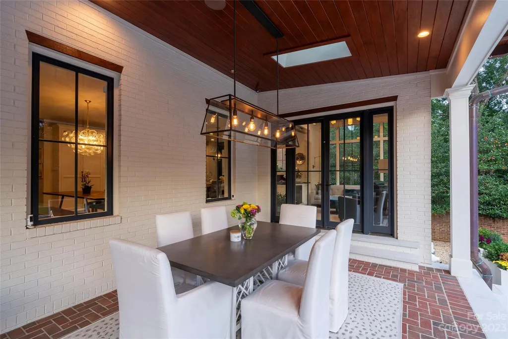 2215 Cortelyou Road Home in Charlotte, North Carolina. Discover the epitome of luxury living in this South Park masterpiece featuring 6 spacious bedrooms, 5 full and 2 half bathrooms, and exquisite craftsmanship throughout. Chef's dream kitchen, a stunning primary suite, media room, sauna, and resort-style outdoor amenities, including a custom pool and outdoor kitchen.
