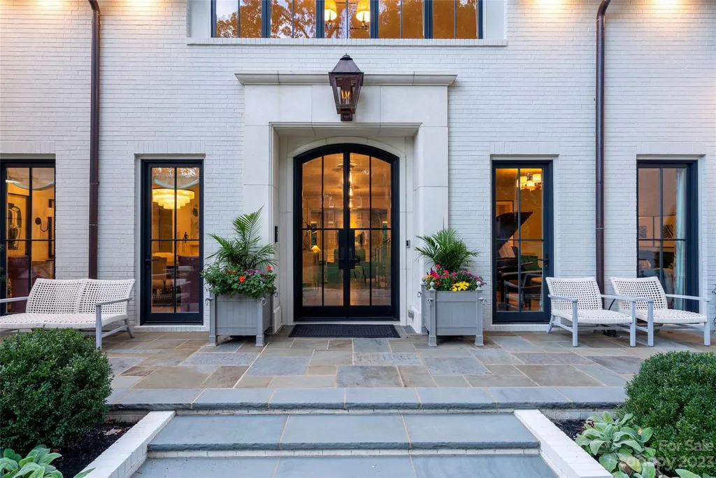 2215 Cortelyou Road Home in Charlotte, North Carolina. Discover the epitome of luxury living in this South Park masterpiece featuring 6 spacious bedrooms, 5 full and 2 half bathrooms, and exquisite craftsmanship throughout. Chef's dream kitchen, a stunning primary suite, media room, sauna, and resort-style outdoor amenities, including a custom pool and outdoor kitchen.
