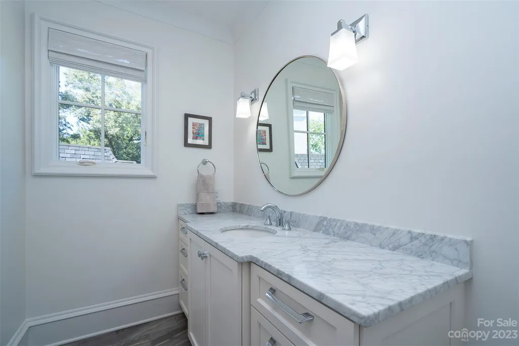 2215 Cortelyou Road Home in Charlotte, North Carolina. Discover the epitome of luxury living in this South Park masterpiece featuring 6 spacious bedrooms, 5 full and 2 half bathrooms, and exquisite craftsmanship throughout. Chef's dream kitchen, a stunning primary suite, media room, sauna, and resort-style outdoor amenities, including a custom pool and outdoor kitchen.