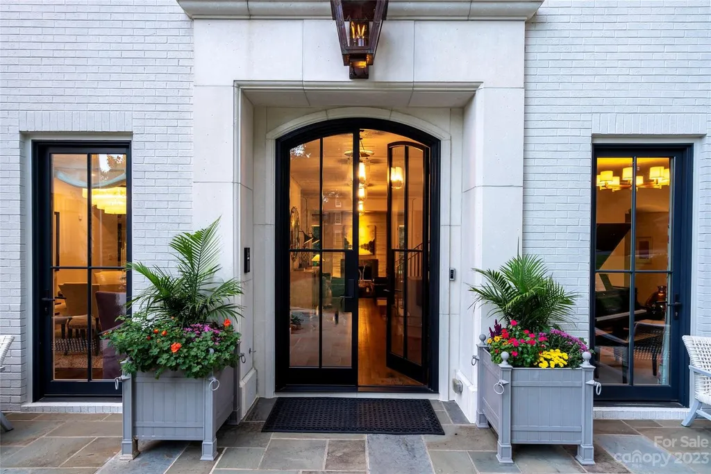 2215 Cortelyou Road Home in Charlotte, North Carolina. Discover the epitome of luxury living in this South Park masterpiece featuring 6 spacious bedrooms, 5 full and 2 half bathrooms, and exquisite craftsmanship throughout. Chef's dream kitchen, a stunning primary suite, media room, sauna, and resort-style outdoor amenities, including a custom pool and outdoor kitchen.