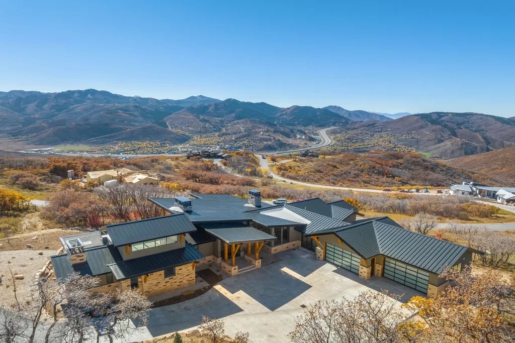 2409 Preserve Drive Home in Park City, Utah. Discover this stunning 6-bedroom, 8-bathroom, 9,196 sq. ft. contemporary home in The Preserve, a premier gated community. Perched on 9.07 acres at the mountain's summit, the home offers breathtaking 280-degree views of ski areas, the Olympic Park, and Salt Lake City.