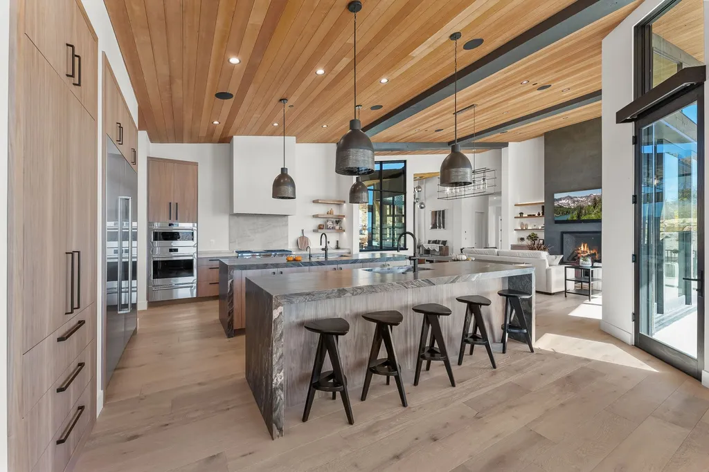2409 Preserve Drive Home in Park City, Utah. Discover this stunning 6-bedroom, 8-bathroom, 9,196 sq. ft. contemporary home in The Preserve, a premier gated community. Perched on 9.07 acres at the mountain's summit, the home offers breathtaking 280-degree views of ski areas, the Olympic Park, and Salt Lake City.