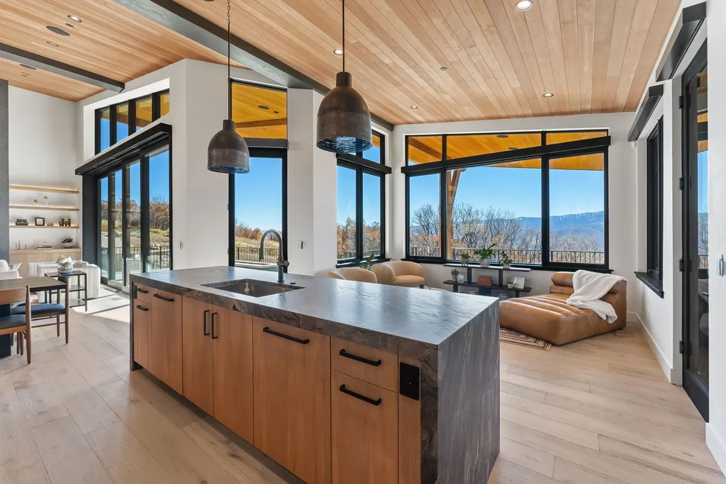 2409 Preserve Drive Home in Park City, Utah. Discover this stunning 6-bedroom, 8-bathroom, 9,196 sq. ft. contemporary home in The Preserve, a premier gated community. Perched on 9.07 acres at the mountain's summit, the home offers breathtaking 280-degree views of ski areas, the Olympic Park, and Salt Lake City.