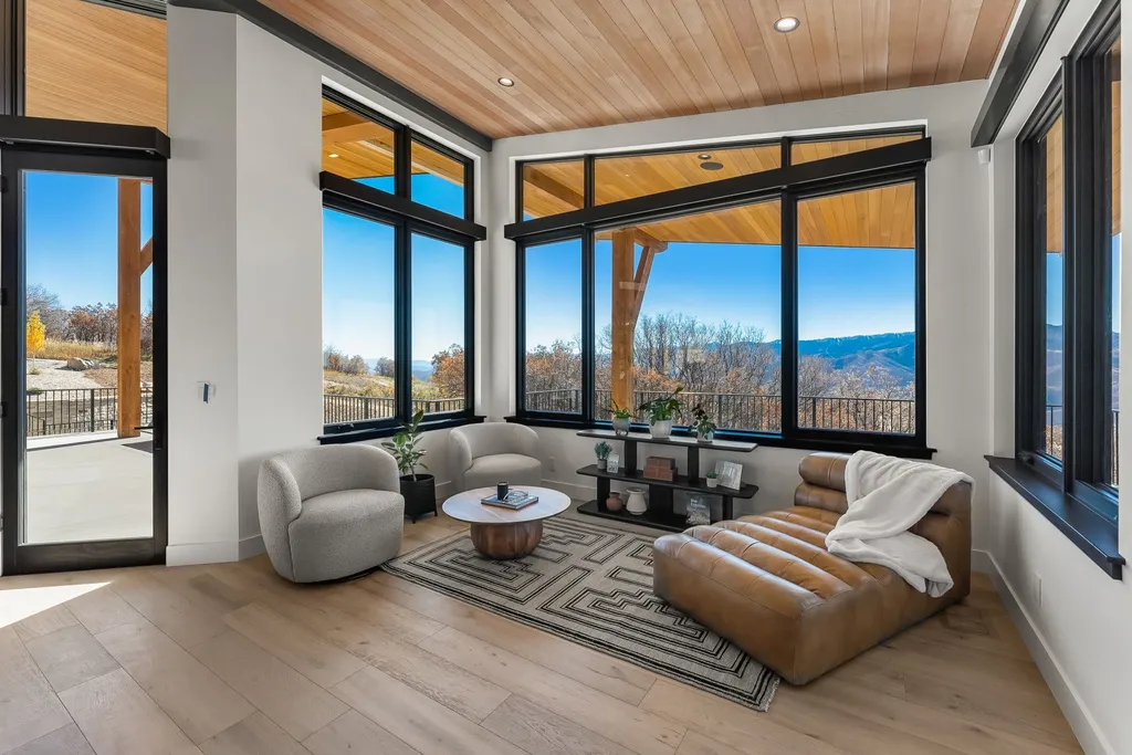 2409 Preserve Drive Home in Park City, Utah. Discover this stunning 6-bedroom, 8-bathroom, 9,196 sq. ft. contemporary home in The Preserve, a premier gated community. Perched on 9.07 acres at the mountain's summit, the home offers breathtaking 280-degree views of ski areas, the Olympic Park, and Salt Lake City.