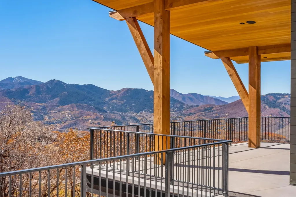 2409 Preserve Drive Home in Park City, Utah. Discover this stunning 6-bedroom, 8-bathroom, 9,196 sq. ft. contemporary home in The Preserve, a premier gated community. Perched on 9.07 acres at the mountain's summit, the home offers breathtaking 280-degree views of ski areas, the Olympic Park, and Salt Lake City.
