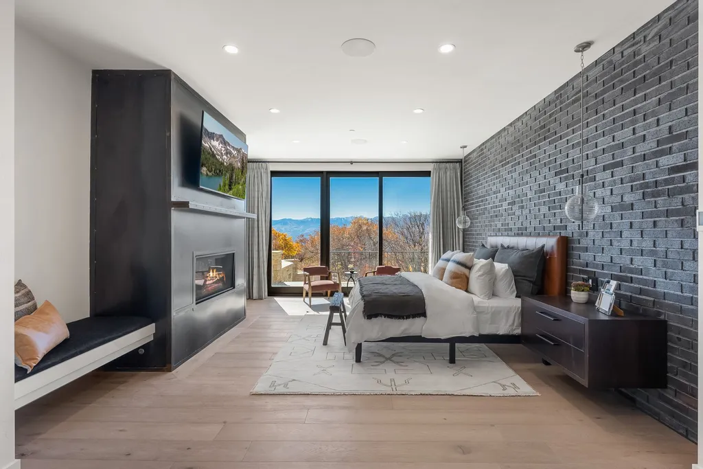 2409 Preserve Drive Home in Park City, Utah. Discover this stunning 6-bedroom, 8-bathroom, 9,196 sq. ft. contemporary home in The Preserve, a premier gated community. Perched on 9.07 acres at the mountain's summit, the home offers breathtaking 280-degree views of ski areas, the Olympic Park, and Salt Lake City.