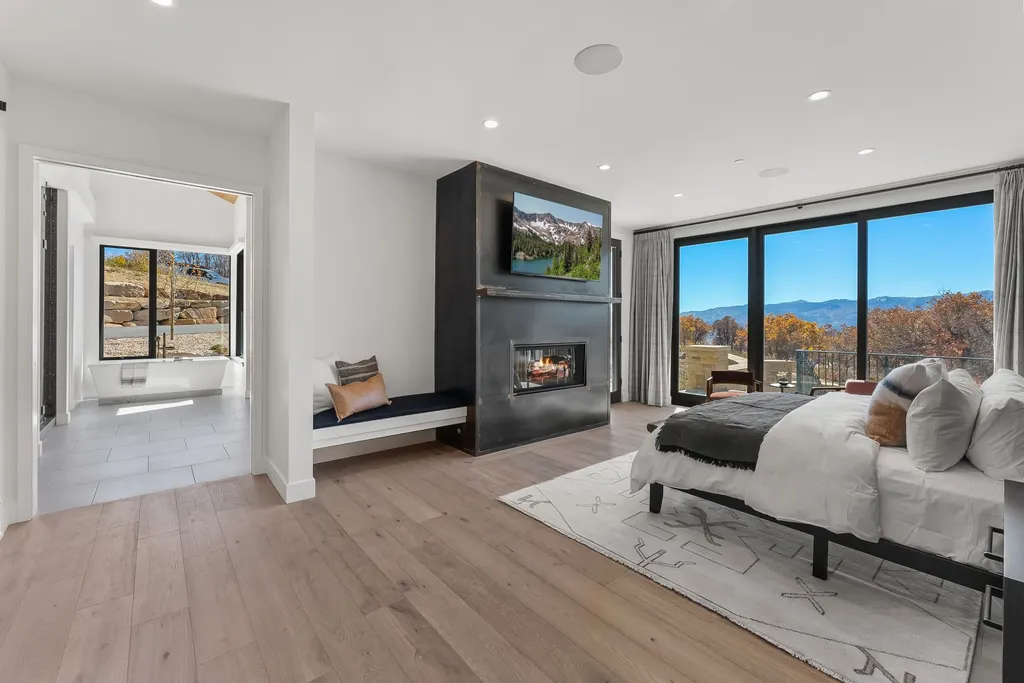 2409 Preserve Drive Home in Park City, Utah. Discover this stunning 6-bedroom, 8-bathroom, 9,196 sq. ft. contemporary home in The Preserve, a premier gated community. Perched on 9.07 acres at the mountain's summit, the home offers breathtaking 280-degree views of ski areas, the Olympic Park, and Salt Lake City.