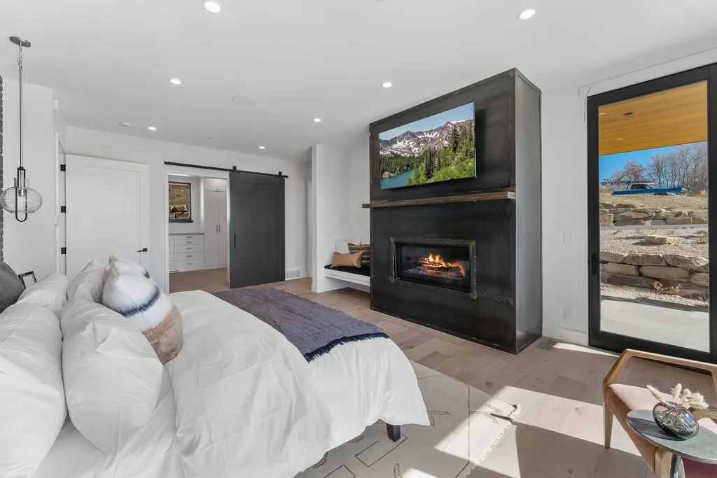 2409 Preserve Drive Home in Park City, Utah. Discover this stunning 6-bedroom, 8-bathroom, 9,196 sq. ft. contemporary home in The Preserve, a premier gated community. Perched on 9.07 acres at the mountain's summit, the home offers breathtaking 280-degree views of ski areas, the Olympic Park, and Salt Lake City.