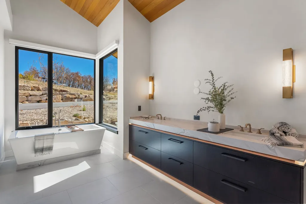 2409 Preserve Drive Home in Park City, Utah. Discover this stunning 6-bedroom, 8-bathroom, 9,196 sq. ft. contemporary home in The Preserve, a premier gated community. Perched on 9.07 acres at the mountain's summit, the home offers breathtaking 280-degree views of ski areas, the Olympic Park, and Salt Lake City.