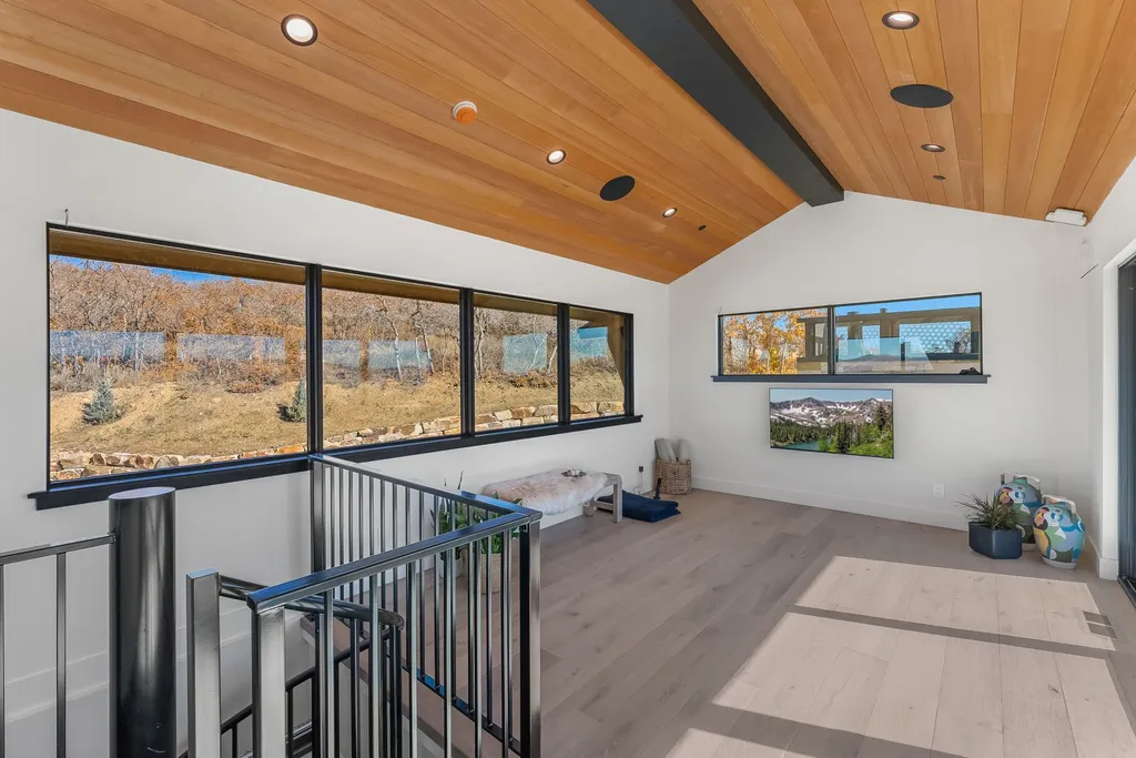 2409 Preserve Drive Home in Park City, Utah. Discover this stunning 6-bedroom, 8-bathroom, 9,196 sq. ft. contemporary home in The Preserve, a premier gated community. Perched on 9.07 acres at the mountain's summit, the home offers breathtaking 280-degree views of ski areas, the Olympic Park, and Salt Lake City.