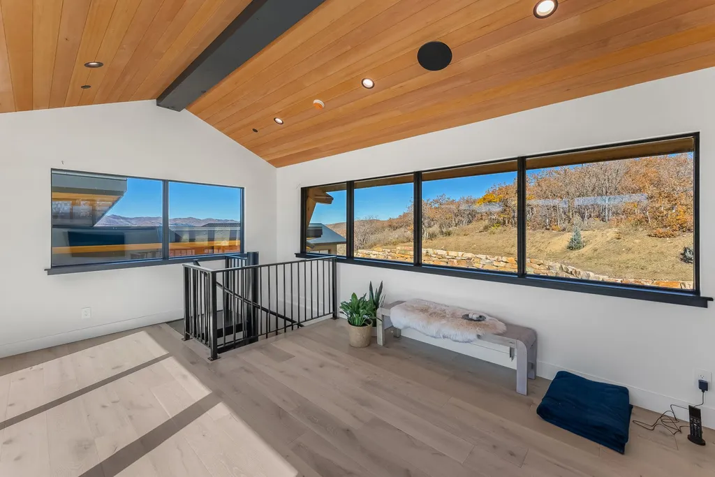 2409 Preserve Drive Home in Park City, Utah. Discover this stunning 6-bedroom, 8-bathroom, 9,196 sq. ft. contemporary home in The Preserve, a premier gated community. Perched on 9.07 acres at the mountain's summit, the home offers breathtaking 280-degree views of ski areas, the Olympic Park, and Salt Lake City.