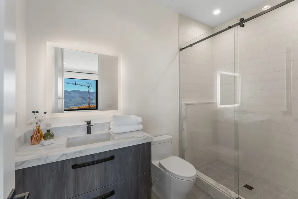 2409 Preserve Drive Home in Park City, Utah. Discover this stunning 6-bedroom, 8-bathroom, 9,196 sq. ft. contemporary home in The Preserve, a premier gated community. Perched on 9.07 acres at the mountain's summit, the home offers breathtaking 280-degree views of ski areas, the Olympic Park, and Salt Lake City.
