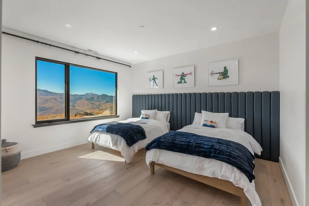 2409 Preserve Drive Home in Park City, Utah. Discover this stunning 6-bedroom, 8-bathroom, 9,196 sq. ft. contemporary home in The Preserve, a premier gated community. Perched on 9.07 acres at the mountain's summit, the home offers breathtaking 280-degree views of ski areas, the Olympic Park, and Salt Lake City.