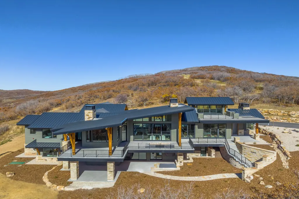 2409 Preserve Drive Home in Park City, Utah. Discover this stunning 6-bedroom, 8-bathroom, 9,196 sq. ft. contemporary home in The Preserve, a premier gated community. Perched on 9.07 acres at the mountain's summit, the home offers breathtaking 280-degree views of ski areas, the Olympic Park, and Salt Lake City.